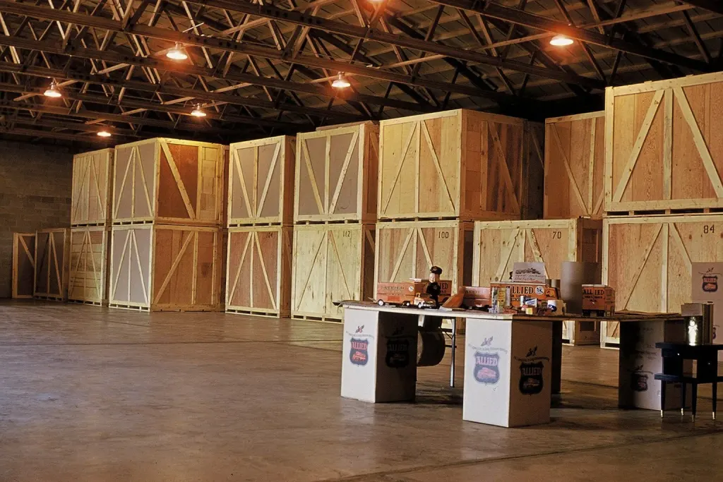 Wooden storage vaults stacked in a moving and storage warehouse