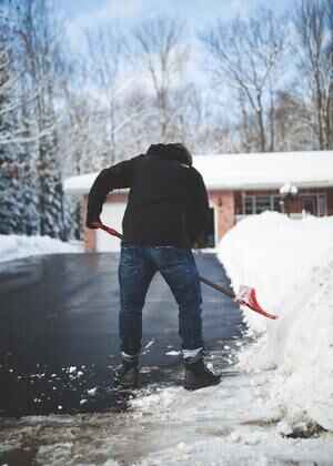 Moving truck navigating snowy conditions during winter move